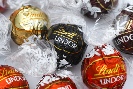 Tambov, Russian Federation - March 08, 2015 Lindt Lindor chocolate truffles. Lindor assorted ballsâ the Lindt milk, dark and white chocolate candies. Studio shot.のeditorial素材