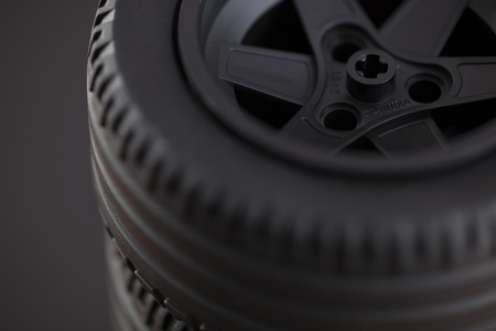Tambov, Russian Federation - January 12, 2014 LEGO wheel on black background. Studio shot. Lego manufactured by the Lego Group Billund, Denmark.のeditorial素材