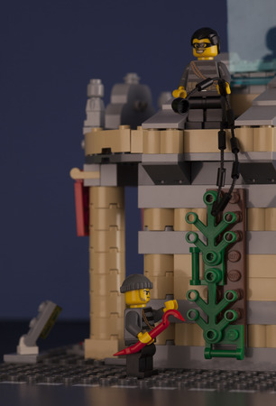 Tambov, Russian Federation - August 26, 2014 LEGO night museum break-in. Two robbers minifigures near museum at night. Studio shot. LEGO is a popular line of construction toys manufactured by the Lego Group (Billund, Denmark).のeditorial素材