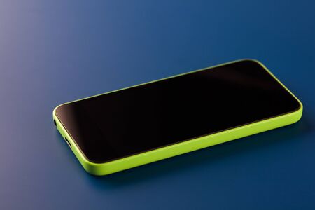 Smart phone on blue backgroundの写真素材