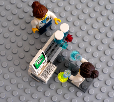Tambov, Russian Federation - June 10, 2015 Two LEGO scientists minifigures near laboratory computer...