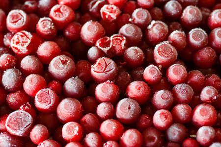 Frozen cowberry. Full frame. Close-up.