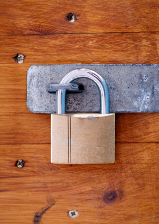 Padlock on wooden door. Close-up.の写真素材