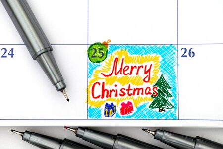 Reminder Merry Christmas in calendar felt pens. の写真素材