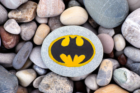 Paphos, Cyprus - November 22, 2016 Sign Batman painted on a pebble with stones background.のeditorial素材