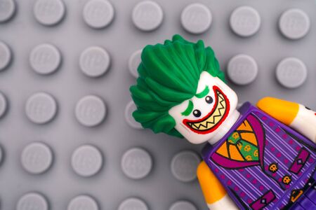 Tambov, Russian Federation - February 11, 2017 Lego Batman Movie minifigure -  The Joker on Lego gray baseplate background. Studio shot.のeditorial素材