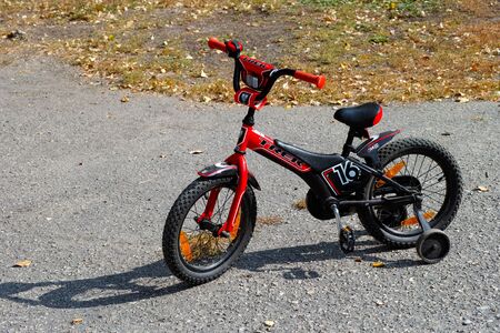 Tambov, Russian Federation - September 27, 2014 Trek Jet 16 child bicycle with training wheels.