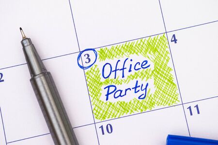 Reminder Office Party in calendar with blue pen. Close-up.の写真素材