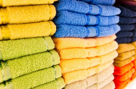 Stacks of different colors towelsの写真素材