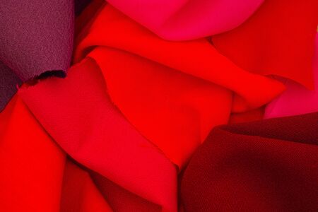 Pieces of red textile. Full frame.
