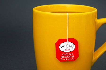 Tambov, Russian Federation - August 28, 2017 Cup of Twinings English Breakfast tea. Dark green background. Studio shot.のeditorial素材