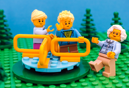 Tambov, Russian Federation - July 30, 2016 Lego kids play on playground with their grandmother in park. Studio shot.のeditorial素材