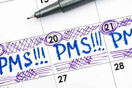 Reminder PMS in calendar with pen. Close-up.の写真素材
