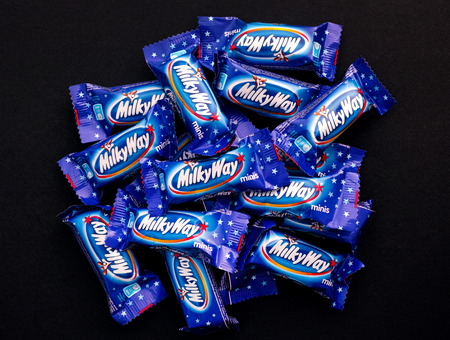 Tambov, Russian Federation - November 15, 2017 Heap of Milky Way minis candy bars on black background. Studio shot.のeditorial素材