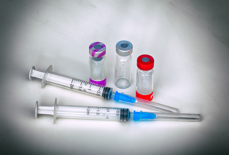 Vaccination. Syringes and vials with of vaccine for pets