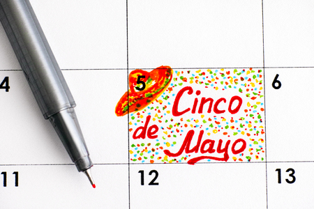 Reminder Cinco de Mayo in calendar with pen. Close-up.の写真素材