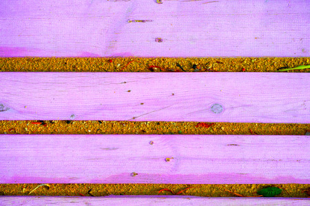 Background of purple wooden planks on the sand. Close-up.の写真素材
