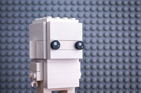 Tambov, Russian Federation - July 29, 2018 Lego white BrickHeadz toy figure against gray baseplate...