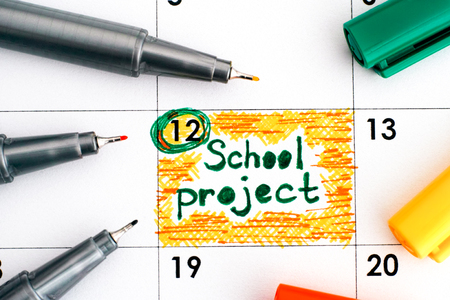 Reminder School Project in calendar with colour pens. Close-up.の写真素材