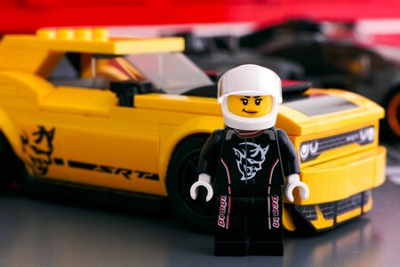 Tambov, Russian Federation - April 21, 2019 Lego 2018 Dodge Challenger SRT Demon driver minifigure by LEGO Speed Champions near his car.のeditorial素材