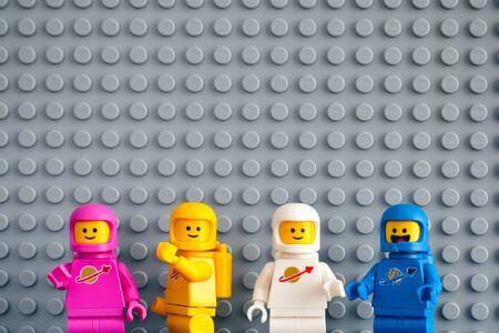 Tambov, Russian Federation - February 24, 2019 Four Lego astronaut minifigures against gray baseplate background. The LEGO Movie 2.のeditorial素材