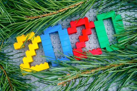 Tambov, Russian Federation - September 28, 2019 Numbers 2020 made by Lego blocks and pine branches...