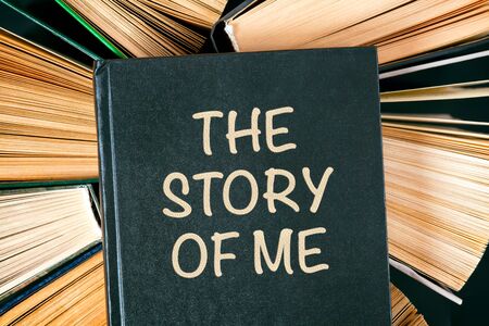 Top view of hardcover books with book The Story of Me on the top.の写真素材