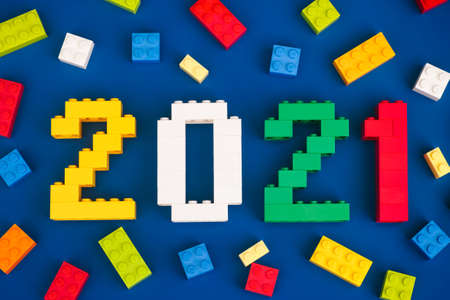 Tambov, Russian Federation - August 26, 2020 Lego numbers 2021 with some Lego bricks on blue background.のeditorial素材