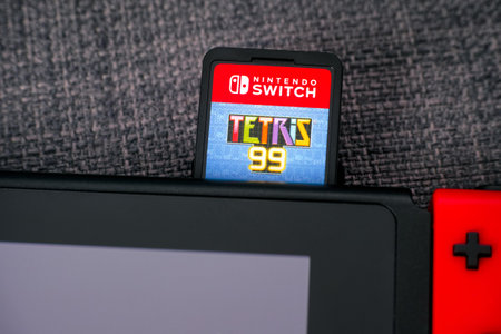 Tambov, Russian Federation - January 01, 2021 Tetris 99 video game cartridge inserts in the Nintendo...