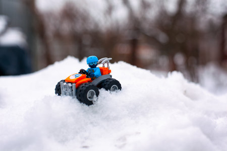 Tambov, Russian Federation - January 28, 2020 Lego all-terrain vehicle with explorer minifigure on snow off road outdoors.のeditorial素材