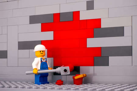 Tambov, Russian Federation - January 17, 2021 Lego painter minifigure painting a wall redのeditorial素材
