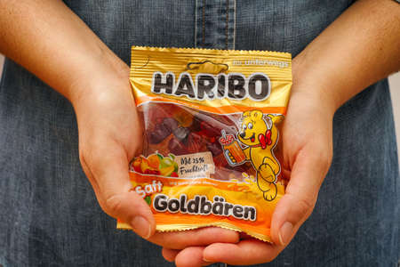 Tambov, Russian Federation - January 06, 2021 Woman palms with pack of Haribo Bears gummy candies.のeditorial素材