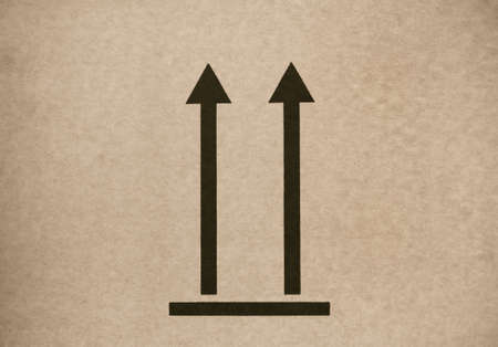This Way Up symbol on cardboard. Close-up.の写真素材