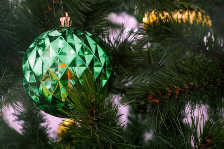 Green Christmas ornament on a christmas tree. Close-upの写真素材