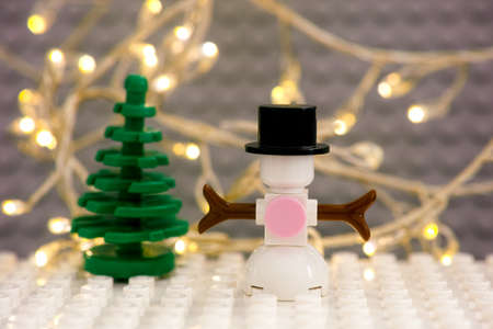 Tambov, Russian Federation - January 17, 2021 Lego Snowman and Christmas tree against Christmas...