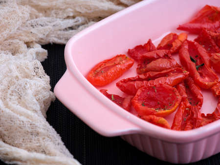 Close-up of Oven dish with sun dried tomatoes.の写真素材