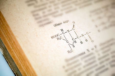 Old Russian chemistry book open on a page with chemical formula of a Penicillin. Close-upの写真素材