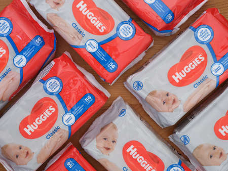 Tambov, Russian Federation - December 21, 2021 A lot of Huggies wet wipes packs on the wooden...