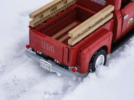 Tambov, Russian Federation - January 16, 2022 The back of a Lego Pickup Truck driving through the...