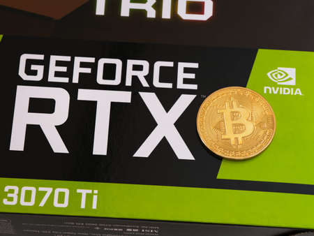 Tambov, Russian Federation - April 27, 2022 A box with a Nvidia Geforce RTX 3070 Ti gaming graphics card with a bitcoin on it.のeditorial素材