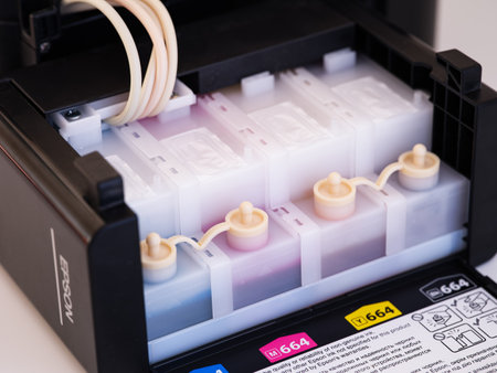 Tambov, Russian Federation - December 06, 2022 A Close-up shot of a continuous ink system of Epson printerのeditorial素材