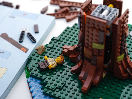Tambov, Russian Federation - June 21, 2022 A Lego set with a big tree being built near an instruction book, some Lego pieces and man minifigureのeditorial素材