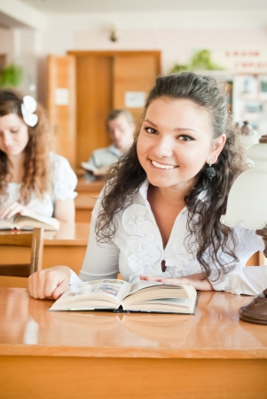 Happy student in libraryの写真素材