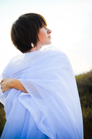 Woman in white fabricsの写真素材