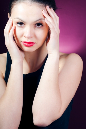 Glamour portrait of beautiful woman model with fresh daily makeup and romantic wavy hairstyle  Fashion shiny highlighter on skin, sexy gloss red lips make-upの写真素材