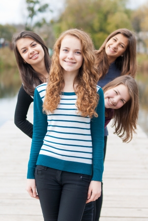 Four happy teenage girls friendsの写真素材