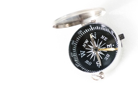 Small pocket compass isolated on white backgroundの写真素材