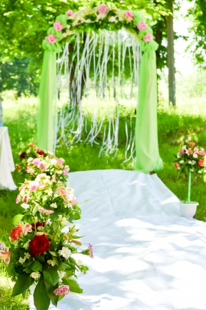 Wedding outdoor ceremony arch flower decorationの写真素材