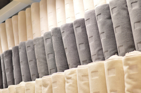 Row of new towels on shelf in department storeの写真素材