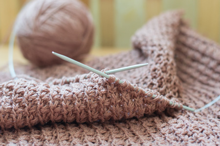 Detail of woven handicraft knit woolen design texture and clew  Fabric pink background